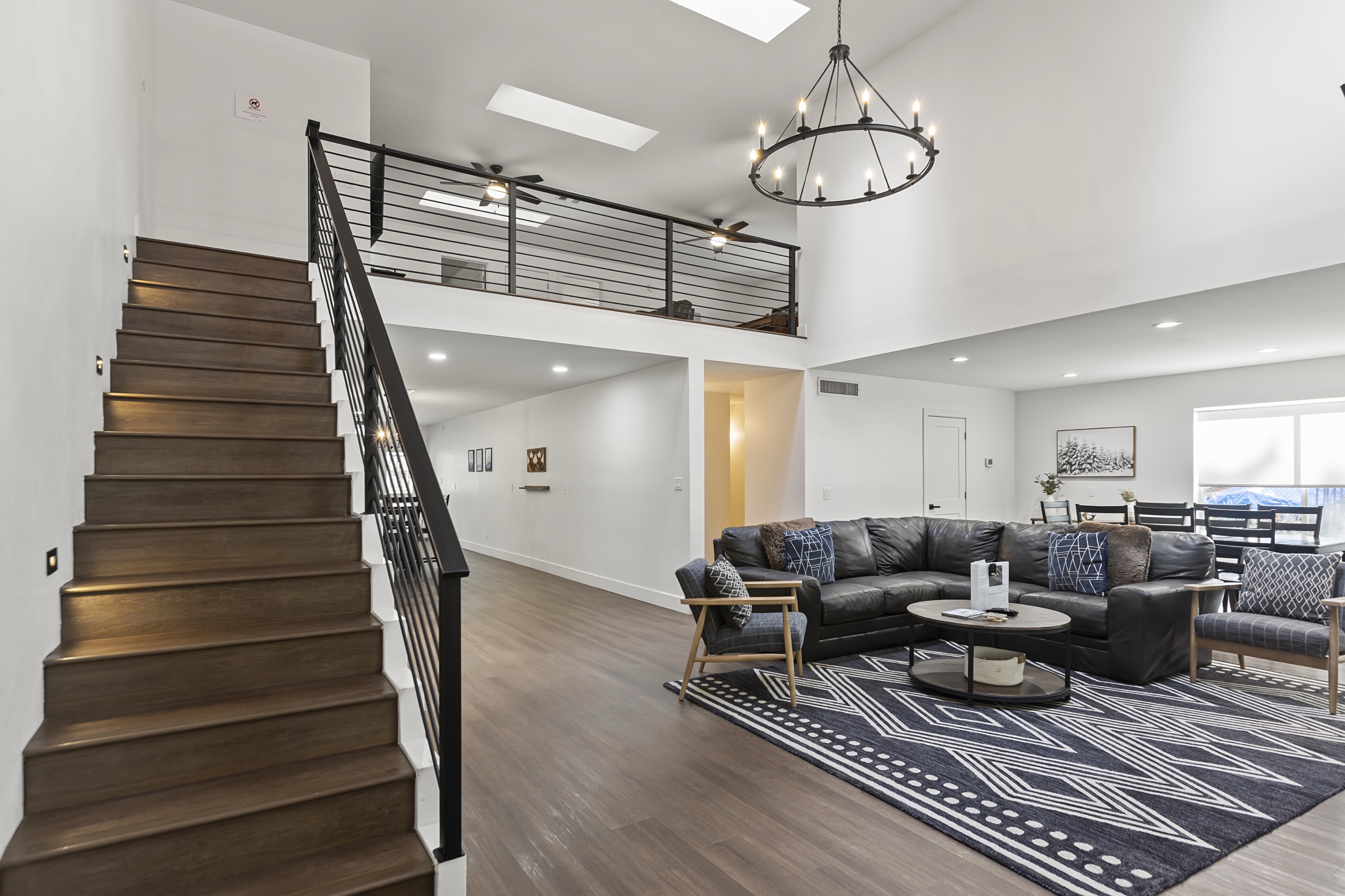 Living room with soaring ceilings and fireplace